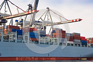 Cargo freight container ship at harbour terminal