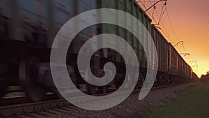 Cargo freight container train in the evening railroad