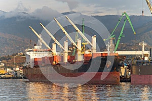 Cargo freight ship in industrial port. Logistics, import and export commerce, international transportation concept