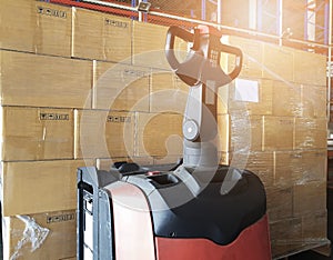 Cargo freight, Shipment, Warehousing service. stack of cardboard boxes on pallet with forklift pallet jack in the warehouse.