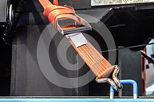 cargo is held by tension safety belts with mechanical locks