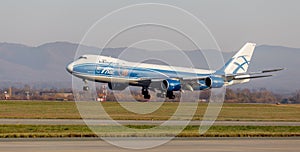 Cargo jet aircraft Boeing 747-BF of AirBridgeCargo Airlines is landing. Airplane fuselage. Aviation and transportation