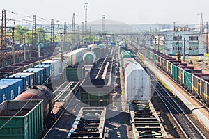 Cargo junction of the railway track. Freight wagons are on the railway