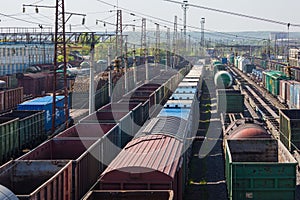 Cargo junction of the railway track. Freight wagons are on the railway.