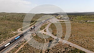 Cargo locomotive railroad engine crossing Arizona desert wilderness. USA