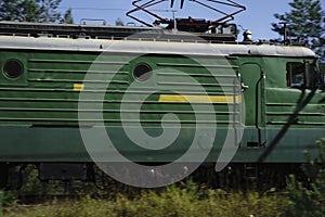 Cargo locomotive railroad engine crossing desert wilderness,rails