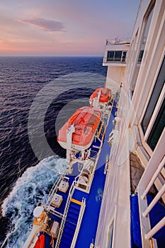 Cargo passenger ferry at sunset