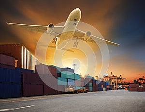 Cargo plane flying above container dock and ship port use for tr