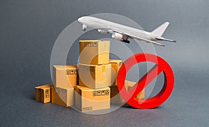 Cargo plane, many boxes and red prohibition symbol NO. Embargo trade wars. Restriction on importation, ban transit export dual-use