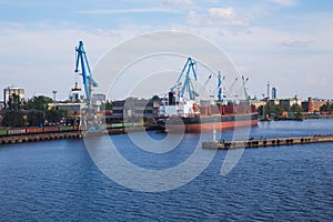 Cargo port, ships and river Daugava. Big ships, old buildings.