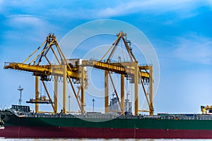 Cargo port was hit by a large crane. The cargo ship docked at the port of import and export