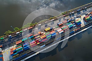 Cargo river harbour with shipping containers.