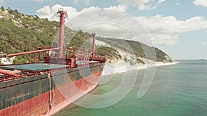 Cargo Ship aground at sea.