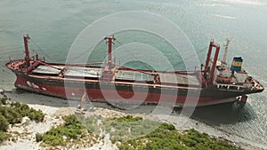 Cargo Ship aground at sea.