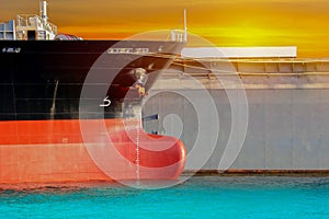 Cargo ship alongside in shipyard