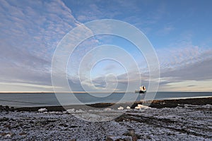 Cargo ship anchored in arctic waters