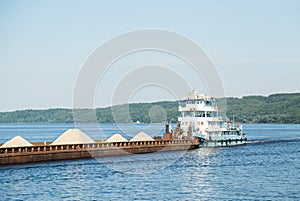 Cargo ship barge loaded with sand