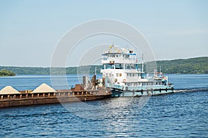 Cargo ship barge loaded with sand