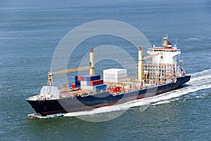 Cargo ship with containers moving