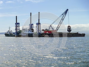 The cargo ship with the crane, the top view. Pipelaying barge.