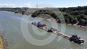 Cargo ship cruising on Danube Black Sea Canal in Romania