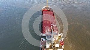 Cargo ship on the danube river, aerial view