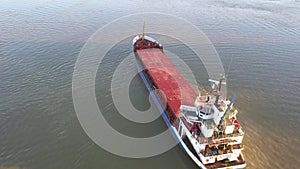 Cargo ship on the danube river, aerial view