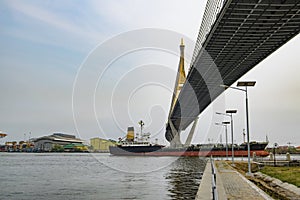 Cargo Ship depart from pier. photo