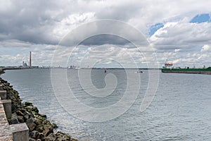 Cargo ship entering Dublin harbour at Poolbeg lighthouse.