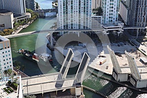 Cargo ship entering the Miami River in Downtown Miami. A divorced bridge. Passage of a cargo ship under the bridge. Taken from the