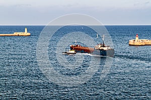 Cargo ship at the entrance to Grand Harbour in Mal