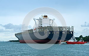 Cargo ship escorted by two guards, empty container ship, sea cargo ship