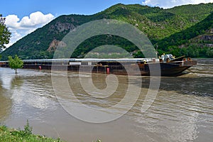 Cargo ship on the flooded river Danube, Wachau