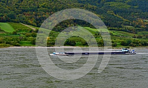 Cargo ship on the flooded river Danube, Wachau