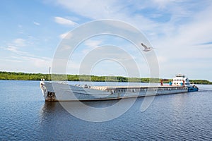 Cargo ship goes on the river Svir River, Russia