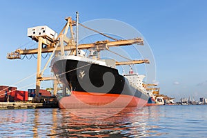 Cargo ship in the harbor for logistic import export background