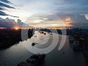 Cargo ship in the harbor at sunset