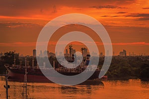 Cargo ship in the harbor at sunset, Bangkok