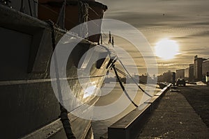 Cargo ship at the harbor in sunset