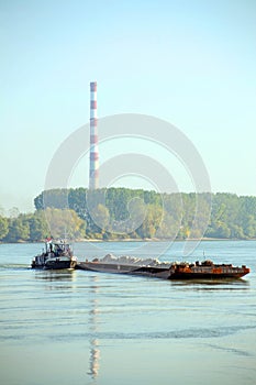 Cargo ship and heating plant at the Danube