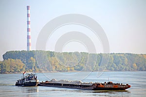 Cargo ship and heating plant at the Danube