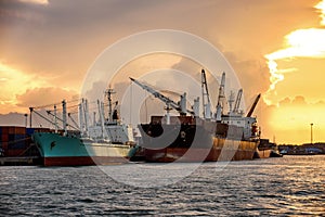 Cargo ship loading containers at sunshine