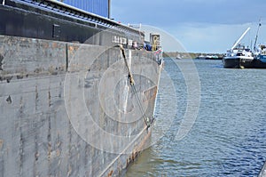 The cargo ship is through the lock and is sailing on river Meuse