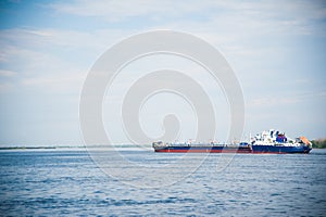 Cargo ship moving along the river