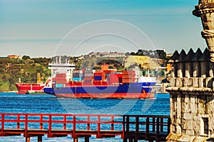 Cargo ship near the Belem tower, Lisbon