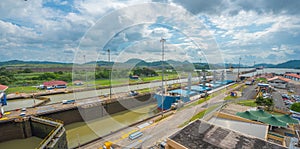 Cargo ship passes through lift locks of the Panama Canal.