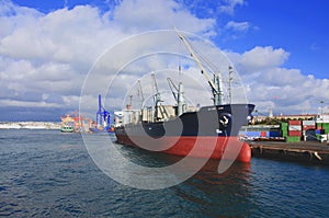 Cargo ship in port photo