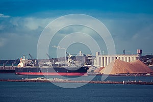 Cargo ship in Portland industrial port, Victoria, Australia.