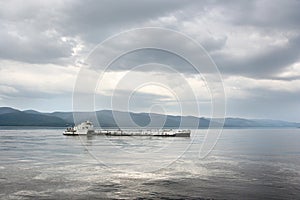 Cargo ship on the river photo