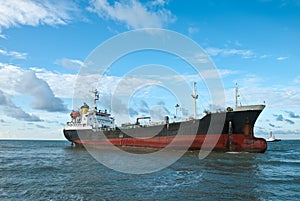Cargo ship run aground on rocky shore